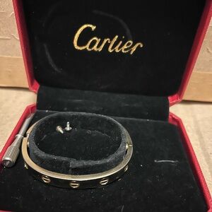 Cartier Men's Gold and Black Bracelet
